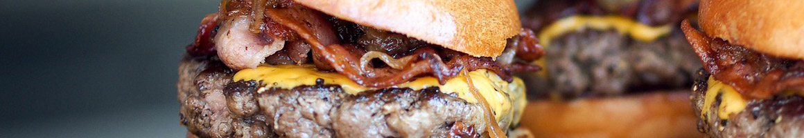 Eating American (New) Burger Sandwich at Bob’s Burgers & Brew restaurant in Puyallup, WA.